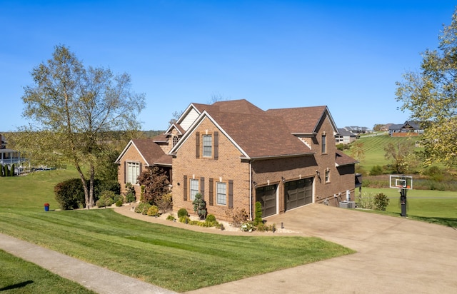 craftsman-style house featuring central air condition unit, a front lawn, and a garage