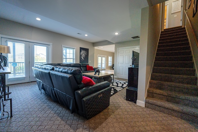 living room with carpet floors and french doors