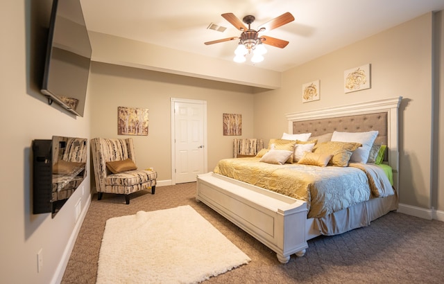 bedroom featuring ceiling fan and carpet