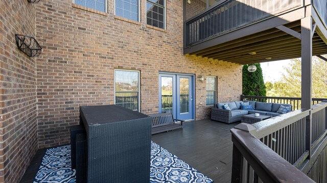 wooden terrace with a lawn