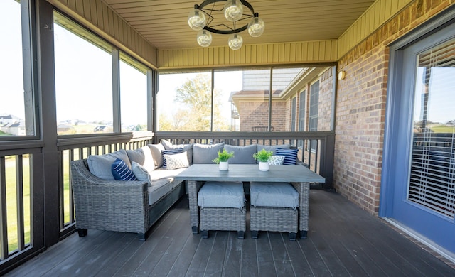 sunroom / solarium featuring wooden ceiling