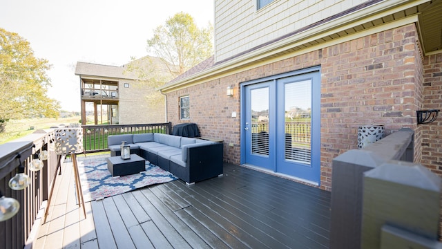 deck with french doors, an outdoor living space, and a grill