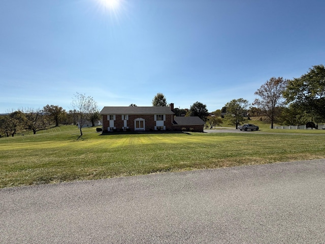 ranch-style house with a front lawn