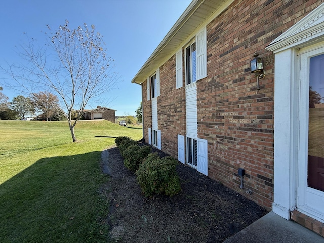 view of side of property featuring a yard