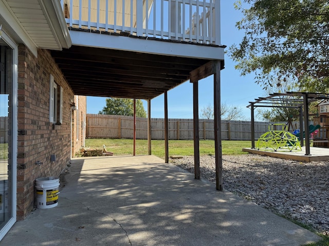 view of patio featuring a playground