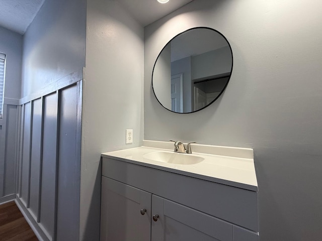 bathroom featuring vanity and hardwood / wood-style flooring