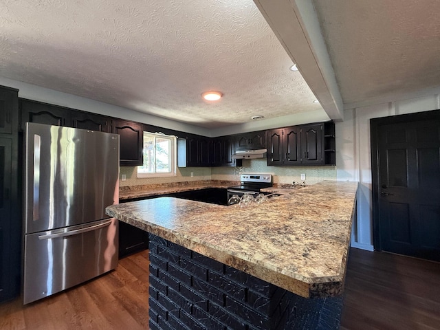 kitchen with dark brown cabinetry, stainless steel appliances, a textured ceiling, and dark hardwood / wood-style flooring