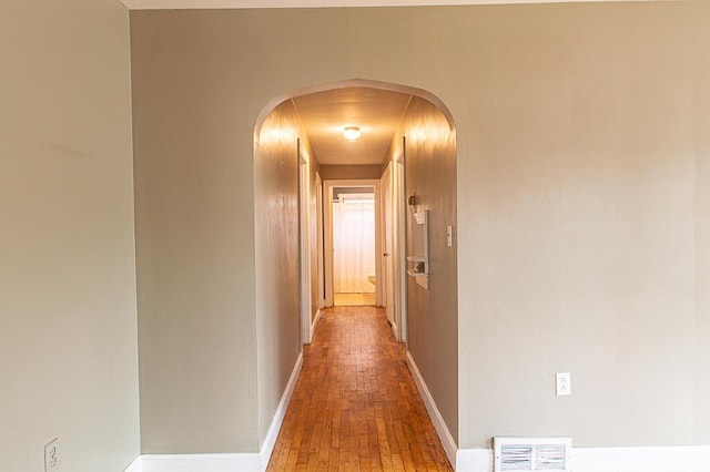 corridor featuring hardwood / wood-style floors