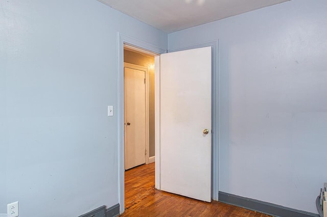 spare room featuring dark hardwood / wood-style floors