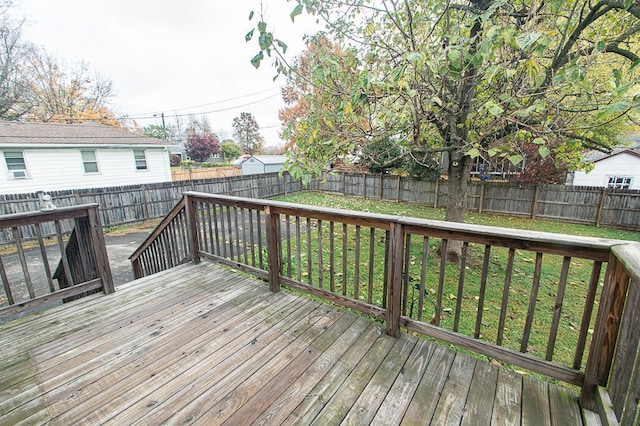 wooden deck with a lawn