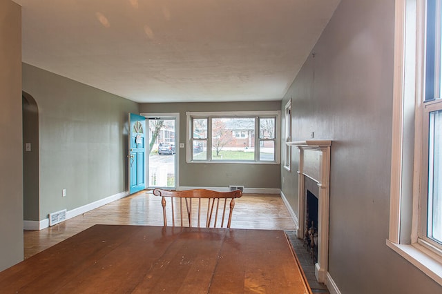 unfurnished living room with hardwood / wood-style floors