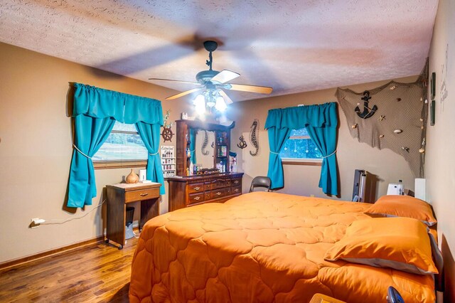 bathroom with a textured ceiling, walk in shower, tile walls, toilet, and vanity