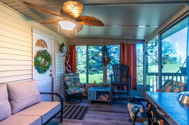 sunroom with a healthy amount of sunlight and ceiling fan