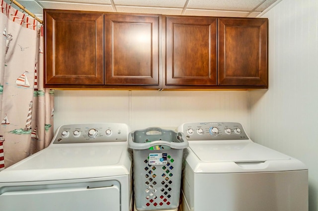 laundry area with cabinets and washing machine and dryer