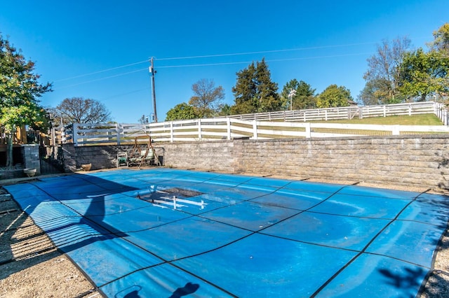 exterior details featuring a pool