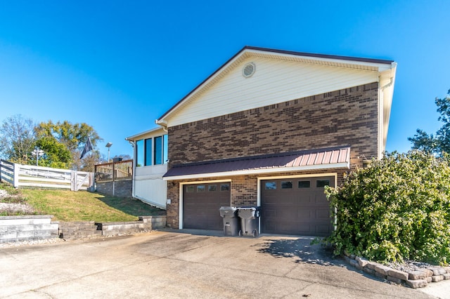 view of property exterior featuring a garage