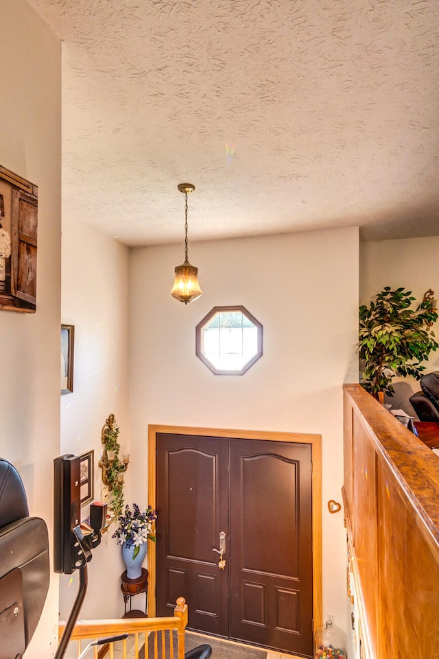 foyer featuring a textured ceiling