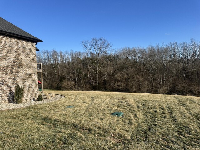 view of yard with a wooden deck