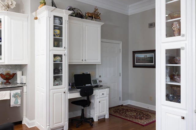 office space featuring crown molding, dark hardwood / wood-style floors, and built in desk