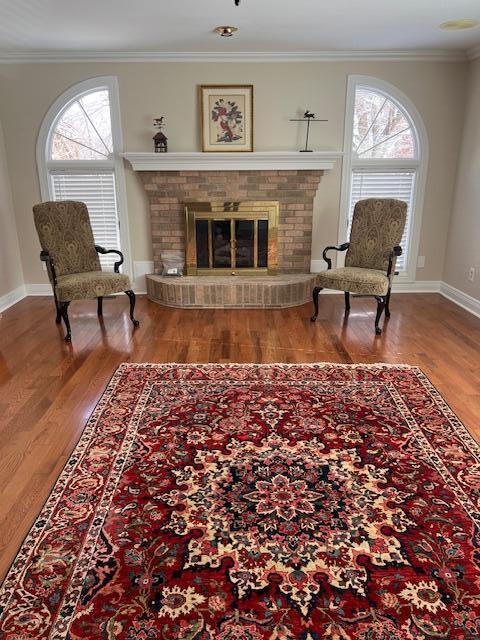 unfurnished room with vaulted ceiling, ceiling fan, dark wood-type flooring, and crown molding