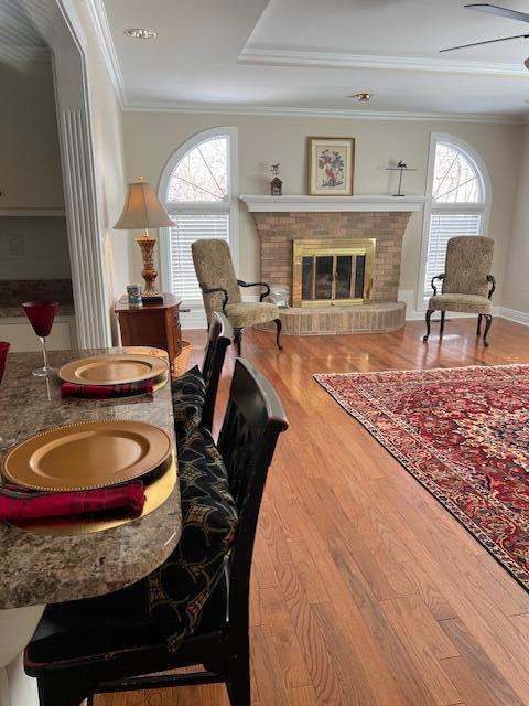 full bathroom with a skylight, crown molding, vanity, and bath / shower combo with glass door