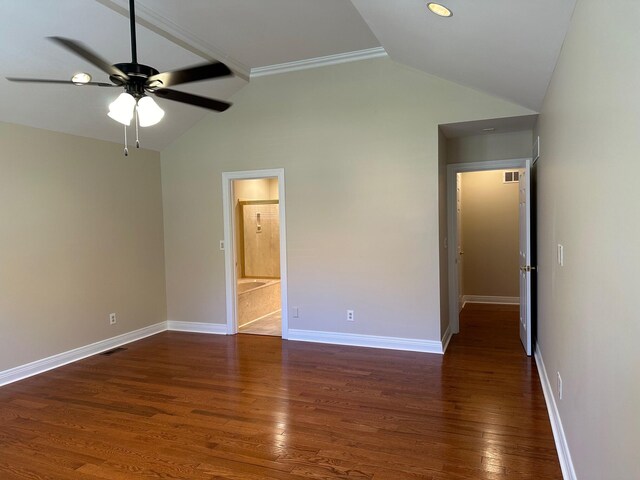 interior space featuring ceiling fan, dark hardwood / wood-style flooring, ensuite bathroom, vaulted ceiling, and ornamental molding