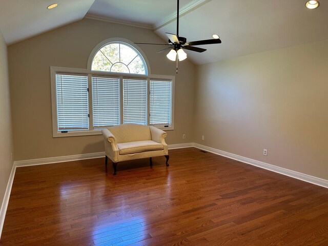 unfurnished room with ceiling fan, dark hardwood / wood-style flooring, lofted ceiling, and ornamental molding