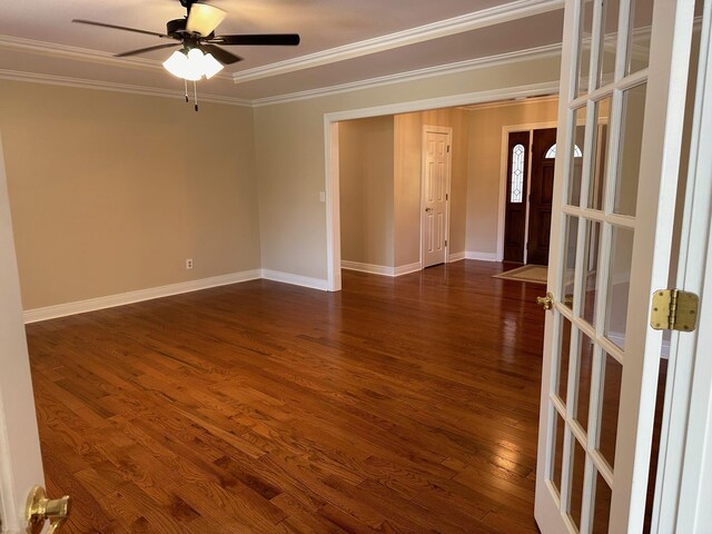 unfurnished room featuring ceiling fan, dark hardwood / wood-style flooring, ornamental molding, and french doors