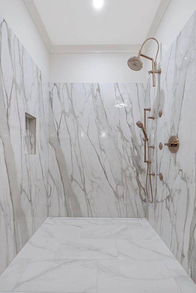 bathroom featuring a tile shower