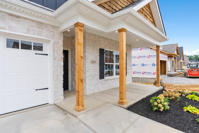 entrance to property featuring a garage