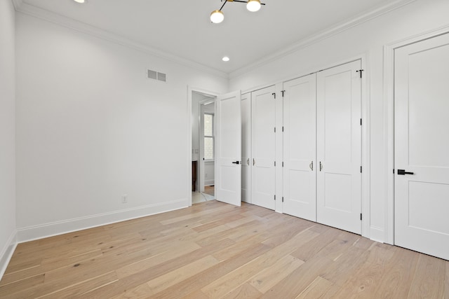 unfurnished bedroom featuring light hardwood / wood-style floors and ornamental molding