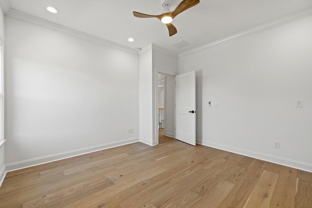 unfurnished room with crown molding, light wood-type flooring, and ceiling fan