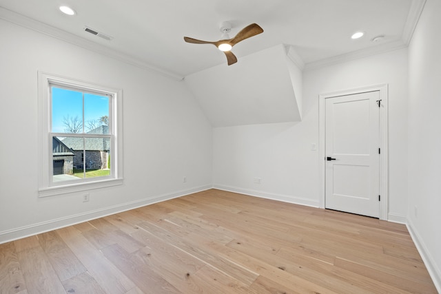 bonus room with vaulted ceiling, light wood-type flooring, and ceiling fan