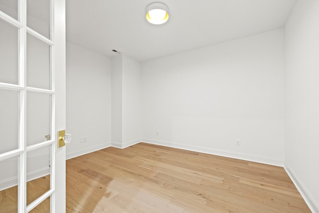 unfurnished room featuring wood-type flooring