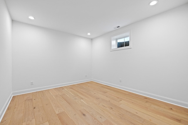 unfurnished room with light wood-type flooring