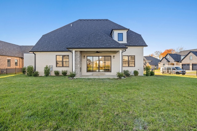 back of house with a patio area, a yard, and ceiling fan