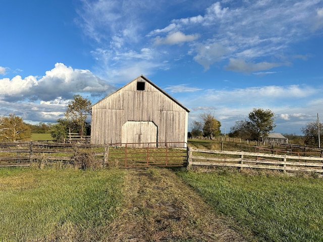 view of outbuilding featuring a rural view