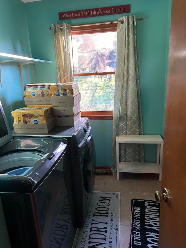 laundry area featuring washing machine and clothes dryer