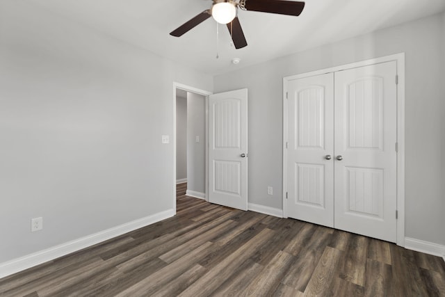 unfurnished bedroom with a closet, ceiling fan, and dark hardwood / wood-style floors