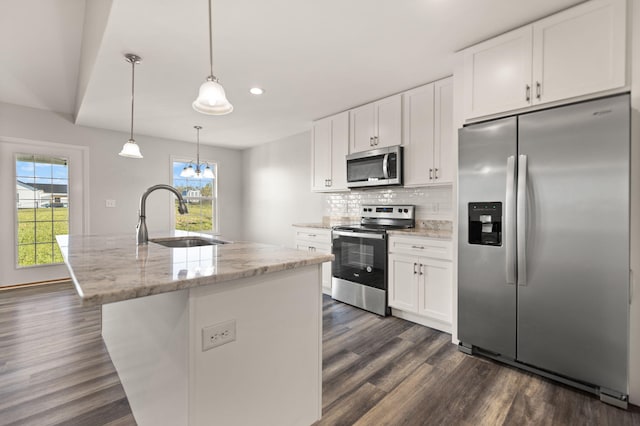 kitchen with sink, a center island with sink, white cabinets, and stainless steel appliances