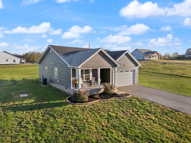 view of front of home featuring covered porch, a garage, central AC, and a front lawn