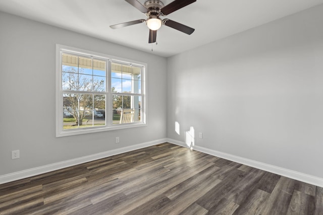 empty room with dark wood-type flooring and ceiling fan