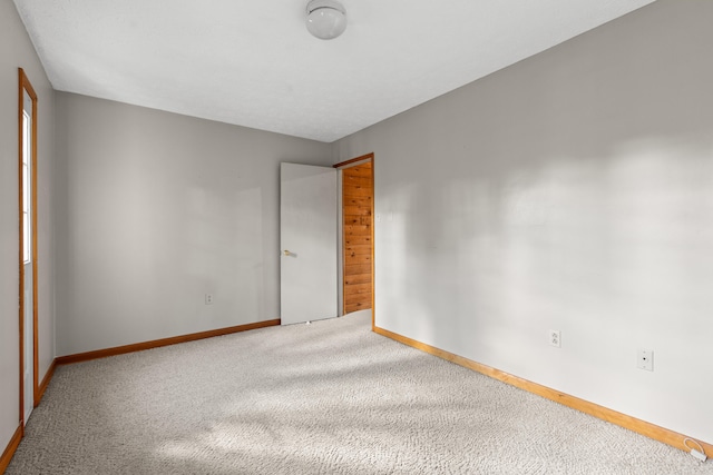 unfurnished room featuring carpet