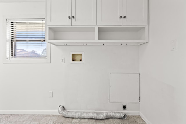 clothes washing area featuring hookup for an electric dryer, washer hookup, and cabinets