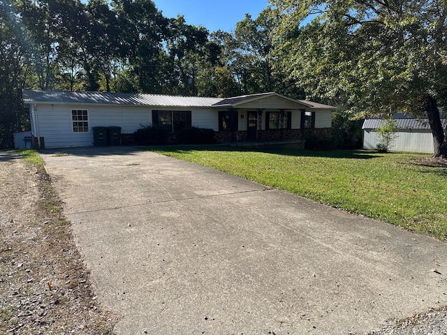 ranch-style house with a front lawn