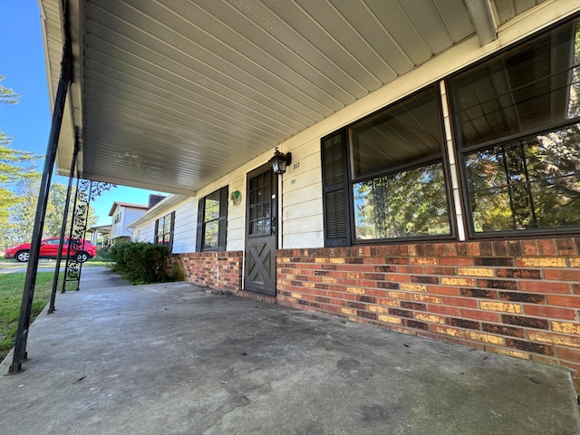 view of patio featuring a porch