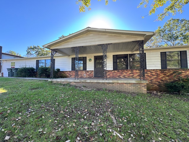 view of front of home featuring a front yard and a porch