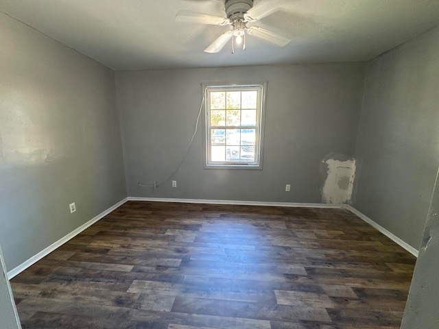 unfurnished room featuring dark hardwood / wood-style floors and ceiling fan