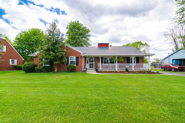 view of front of house with a porch and a front lawn