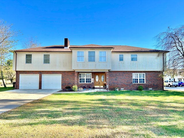 view of front facade with a garage and a front yard